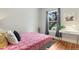 Bright bedroom with hardwood floors and a sun-filled window at 3953 Tejon St, Denver, CO 80211