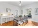 Bright dining area boasts wood floors and transitions to living space with an elegant buffet at 3953 Tejon St, Denver, CO 80211