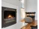 Cozy fireplace with decorative tile surround and a comfortable seating area at 3953 Tejon St, Denver, CO 80211