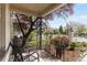 Relaxing front porch with seating and a view of the street and surrounding greenery at 3953 Tejon St, Denver, CO 80211