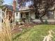 Inviting home with well-maintained front yard landscaping, showcasing a blend of plants and flowers at 3953 Tejon St, Denver, CO 80211