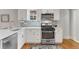 Well-equipped kitchen boasts stainless steel appliances and ample counter space at 3953 Tejon St, Denver, CO 80211