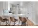 Modern kitchen features quartz counters, stainless appliances, and bar seating at 3953 Tejon St, Denver, CO 80211