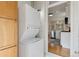 Convenient in-unit laundry closet adjacent to the kitchen at 3953 Tejon St, Denver, CO 80211