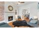 Bright and airy living room with a fireplace, hardwood floors, and ample seating at 3953 Tejon St, Denver, CO 80211