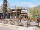 Expansive outdoor seating area at The Monkey Barrel with wooden picnic tables and umbrellas for a casual dining experience at 3953 Tejon St, Denver, CO 80211
