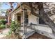 Quaint front porch with decorative iron railings and seating area at 3953 Tejon St, Denver, CO 80211