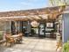 Inviting restaurant entrance with a covered patio, hanging plants, and visible interior seating at 3953 Tejon St, Denver, CO 80211