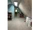 Attic space with skylight and carpet, accessible via a doorway, offering a cozy retreat at 8501 W 52Nd Ave, Arvada, CO 80002