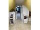 Attic hallway with built-in shelving and access to additional rooms at 8501 W 52Nd Ave, Arvada, CO 80002