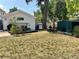 Backyard featuring a storage shed, mature trees, and ample space for gardening and outdoor activities at 8501 W 52Nd Ave, Arvada, CO 80002