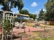 Backyard features a brick patio, garden trellis, and a charming seating area, perfect for outdoor entertaining at 8501 W 52Nd Ave, Arvada, CO 80002