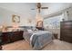 Comfortable bedroom featuring plush bedding, bright window, and complementary furnishings at 8501 W 52Nd Ave, Arvada, CO 80002