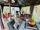 Covered patio with ample seating and decor, creating a relaxing outdoor space at 8501 W 52Nd Ave, Arvada, CO 80002