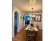 Cozy dining room area with hardwood floors, tiled dining table, and natural light at 8501 W 52Nd Ave, Arvada, CO 80002