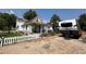 Lovely home with a landscaped yard, white picket fence, and RV parking at 8501 W 52Nd Ave, Arvada, CO 80002