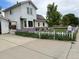Lovely home with a white picket fence border and curb appeal, beautiful lawn and landscaping at 8501 W 52Nd Ave, Arvada, CO 80002