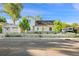 Charming two-story home featuring a white picket fence, solar panels, and a detached garage at 8501 W 52Nd Ave, Arvada, CO 80002