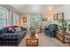 Comfortable living room with cozy seating, natural light, and neutral decor at 8501 W 52Nd Ave, Arvada, CO 80002