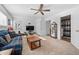 Spacious living room featuring plush seating, and a fireplace. Access to bathroom and other rooms at 8501 W 52Nd Ave, Arvada, CO 80002