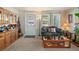 Cozy living room with plush carpeting, large windows, and natural light at 8501 W 52Nd Ave, Arvada, CO 80002