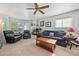 Inviting living room with cozy fireplace, comfortable seating, and natural light from the windows at 8501 W 52Nd Ave, Arvada, CO 80002
