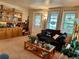 Cozy living room with plush carpeting, large windows, and natural light at 8501 W 52Nd Ave, Arvada, CO 80002