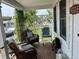 Cozy porch area with wicker chairs, a rocking chair, and a welcoming atmosphere at 8501 W 52Nd Ave, Arvada, CO 80002