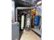 A utility room featuring a water heater, filtration system, and other equipment at 8501 W 52Nd Ave, Arvada, CO 80002