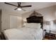 Cozy bedroom with a large headboard, soft lighting, and a spacious closet at 10150 E Virginia Ave # 18-302, Denver, CO 80247