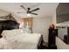 Comfortable bedroom features a ceiling fan and a large decorative headboard at 10150 E Virginia Ave # 18-302, Denver, CO 80247