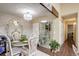 Bright dining area featuring a chandelier, adjacent to an open floor plan at 10150 E Virginia Ave # 18-302, Denver, CO 80247