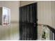 Front door with black security gate, secure mailbox and stylish exterior at 10150 E Virginia Ave # 18-302, Denver, CO 80247