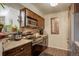 Modern kitchen with stainless steel appliances, dark wood cabinets, and tile backsplash at 10150 E Virginia Ave # 18-302, Denver, CO 80247