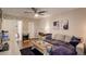 Spacious living room with hardwood floors, comfortable sectional sofa, and ample natural light at 10150 E Virginia Ave # 18-302, Denver, CO 80247