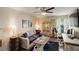 Relaxing living room with modern furnishings, hardwood floors and a ceiling fan at 10150 E Virginia Ave # 18-302, Denver, CO 80247