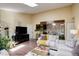 Bright and airy living room featuring hardwood floors, skylight and an open layout at 10150 E Virginia Ave # 18-302, Denver, CO 80247