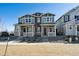 Charming townhome showcases a well-maintained front yard, complementing its appealing two-story facade at 1244 Penner Dr, Erie, CO 80026