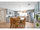 Open kitchen with gray cabinetry, stainless steel appliances, and a dining area perfect for gatherings at 2963 S Ivan Way, Denver, CO 80227