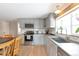 Stylish kitchen with sleek countertops, stainless steel appliances, and ample cabinet space at 2963 S Ivan Way, Denver, CO 80227