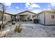 Fenced backyard with patio, grill, detached shed, and trampoline at 327 N 12Th Ave, Brighton, CO 80601