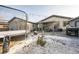 Backyard with a trampoline, patio furniture, outdoor lights, and some snow on the ground at 327 N 12Th Ave, Brighton, CO 80601