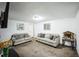 Basement living room featuring neutral walls, carpet, and comfortable gray sofas at 327 N 12Th Ave, Brighton, CO 80601