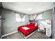 Cozy bedroom featuring a comfortable bed, soft carpet, and a vanity for getting ready at 327 N 12Th Ave, Brighton, CO 80601