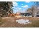 Large backyard offers a great space for recreation, along with patio adjacent to the home at 211 Newport St, Denver, CO 80220