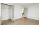 Spacious bedroom with an open closet and hardwood floors, offering ample storage at 211 Newport St, Denver, CO 80220