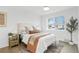 Bright bedroom with a large window, stylish decor, and a cozy atmosphere at 211 Newport St, Denver, CO 80220