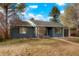 Charming single-story home with blue painted brick and well-maintained yard, complete with a detached garage at 211 Newport St, Denver, CO 80220