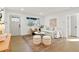 Inviting living room with hardwood floors, a neutral color palette, and a comfortable seating arrangement with plenty of natural light at 211 Newport St, Denver, CO 80220
