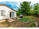 Relaxing backyard with patio, picnic table, and garden bed for outdoor enjoyment at 4520 E 112Th Pl, Thornton, CO 80233